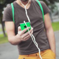 Man with phone and headphones