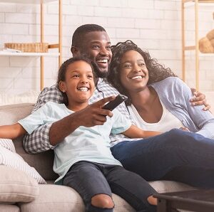 Happy,African,American,Family,Relaxing,And,Watching,Tv,At,Home,