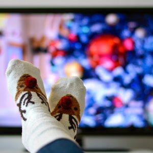 Cozy,Warm,Winter,Christmas,Socks,With,A,Reindeer.,Person,Watching