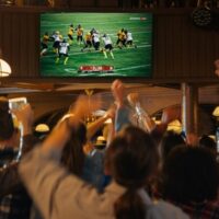 Group,Of,American,Football,Fans,Watching,A,Live,Match,Broadcast