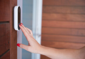 Close,Up,Of,Woman,Ringing,Front,Doorbell,Equipped,With,Security